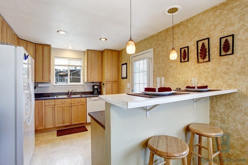small-kitchen-area-with-granite-tops-white-appliances